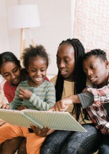 mom of color reading to her children