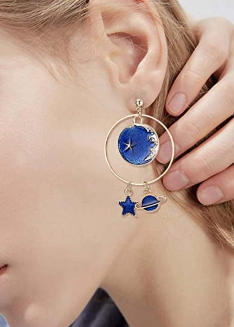 Close up of ear with solar stem earrings